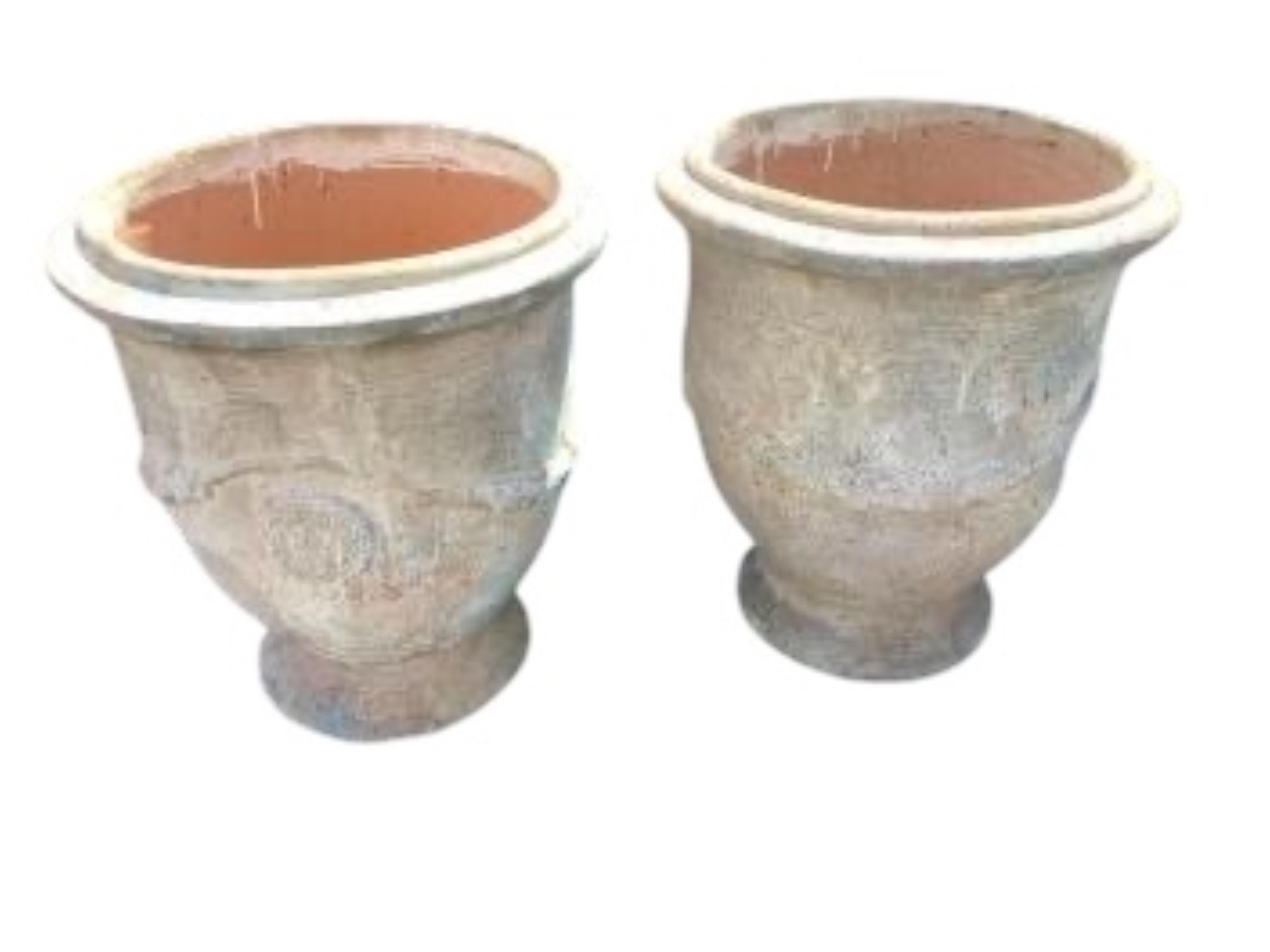 A pair of large circular earthenware garden planters, diameter 61cm, height 68cm
